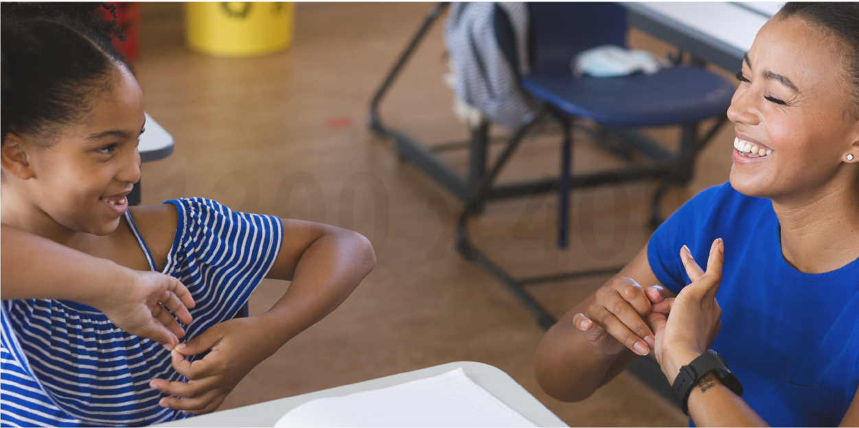 Teacher and student communicating with Americal Sign Language